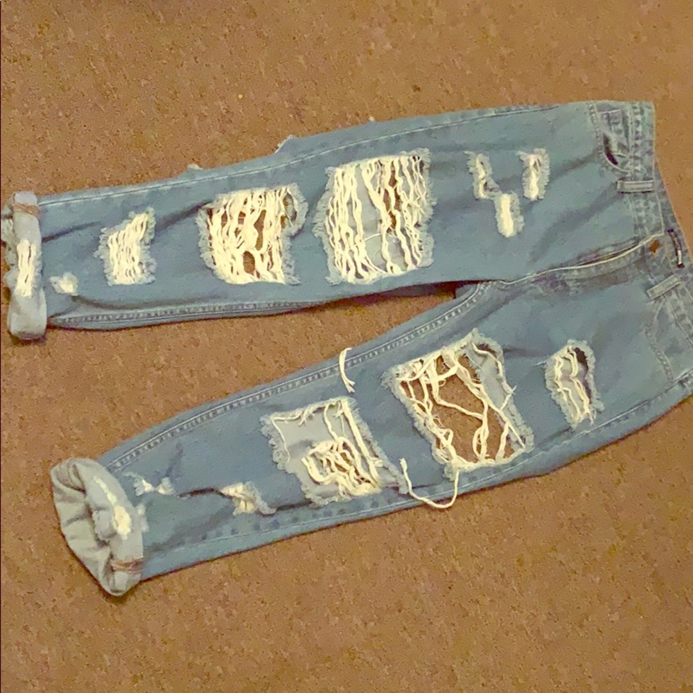 Fashion nova Distressed jeans. Front and back rips